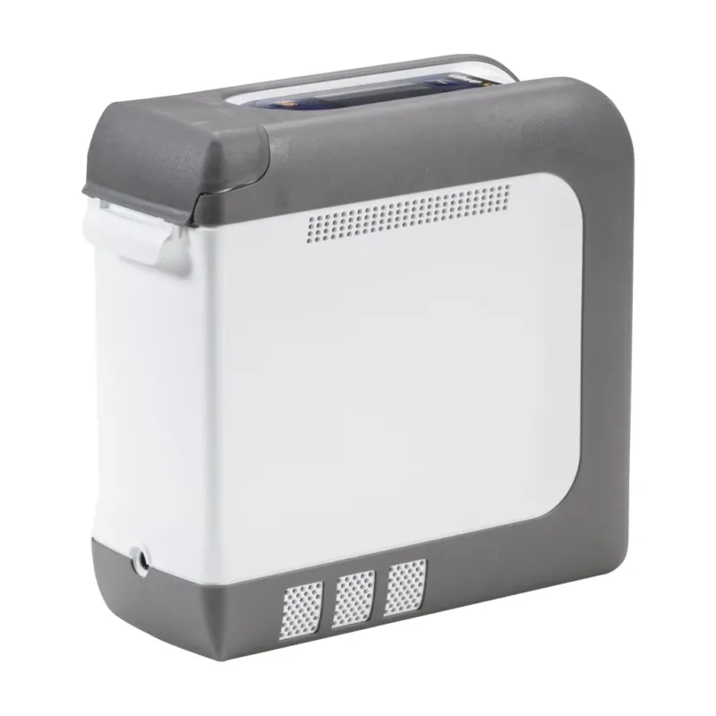 Tragbarer Sauerstoffkonzentrator iGo2 von Drive Medical in Seitenansicht, kompakt und leicht im Design mit grauen Schutzkanten und Luftauslässen – ideal für den mobilen Einsatz.